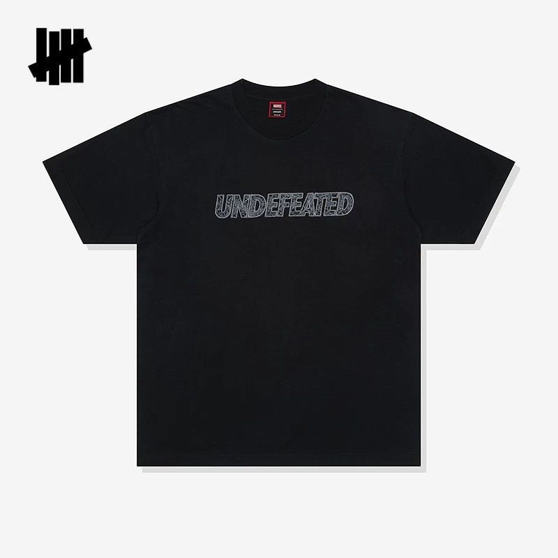 เสื้อยืดแขนสั้นลายโลโก้ใยแมงมุ - Streetwear Brand Undefeated บทวิจารณ์และราคา