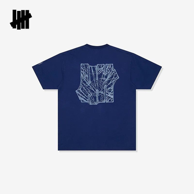 เสื้อยืดแขนสั้นลายโลโก้ใยแมงมุ - Streetwear Brand Undefeated บทวิจารณ์และราคา